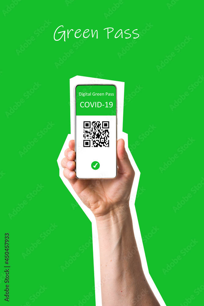 The digital green pass of the EU with the QR code on the screen of a mobile held by a hand with  green background. Immunity from Covid-19. Permit to travel without restrictions in Europe. - obrazy, fototapety, plakaty 