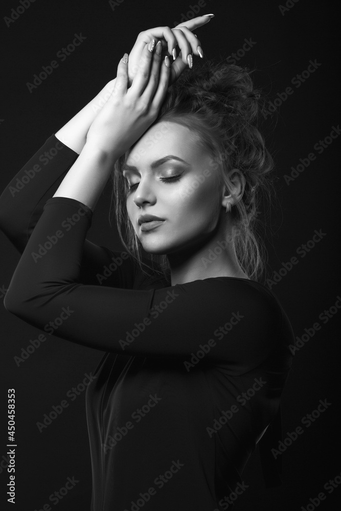 Monochrome studio portrait of a troubled woman