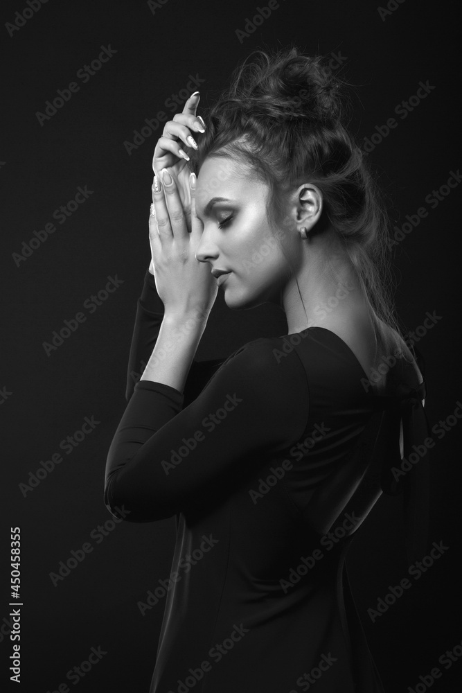 Monochrome studio portrait of a dreaming woman Monochrome studio portrait of a dreaming woman