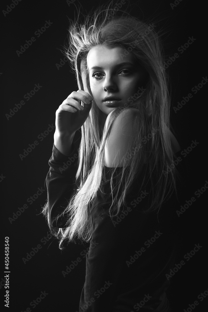 Black and white portrait of an attractive woman with bare shoulders Black and white portrait of an attractive woman with bare shoulders