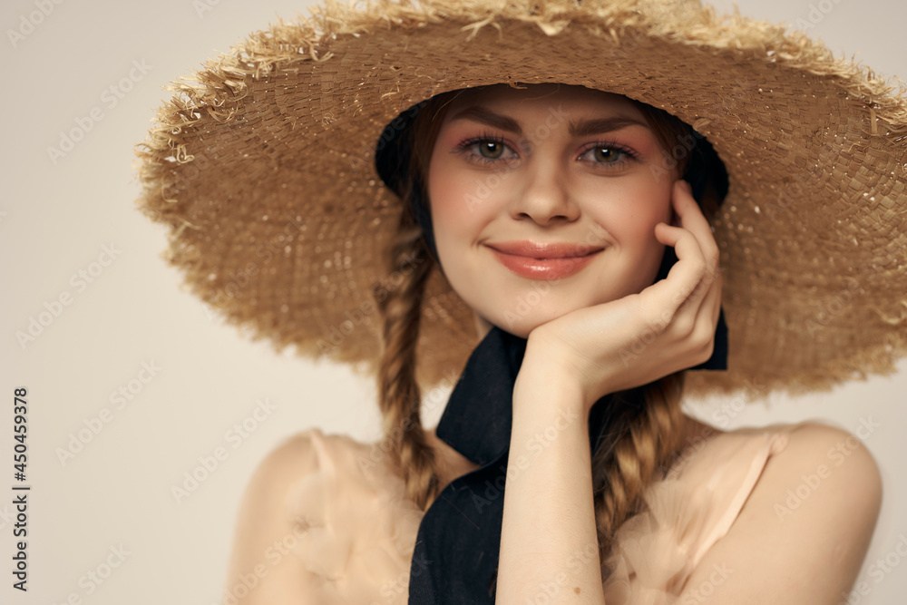 cheerful woman beach hat pigtails modern style summer close-up beige background cheerful woman beach hat pigtails modern style summer close-up beige background