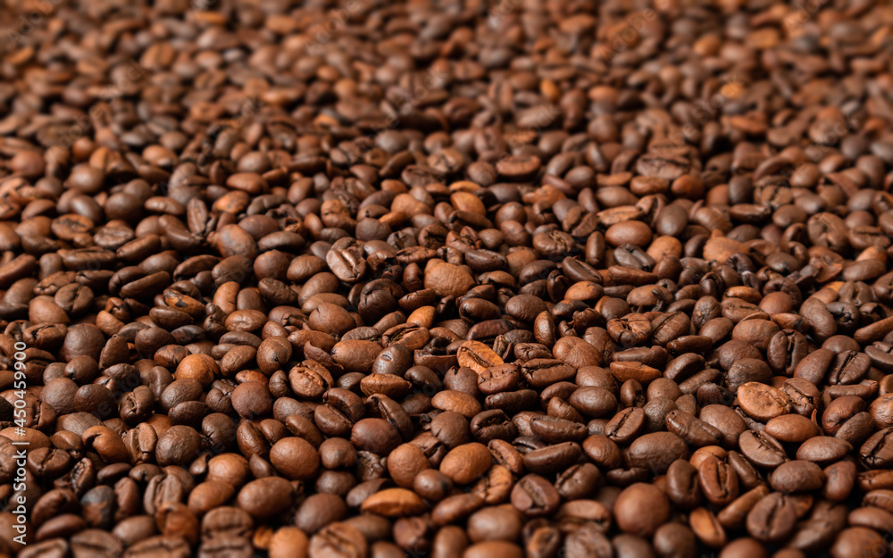 Fresh roasted coffee beans background. Selective focus. Fresh roasted coffee beans background. Selective focus.