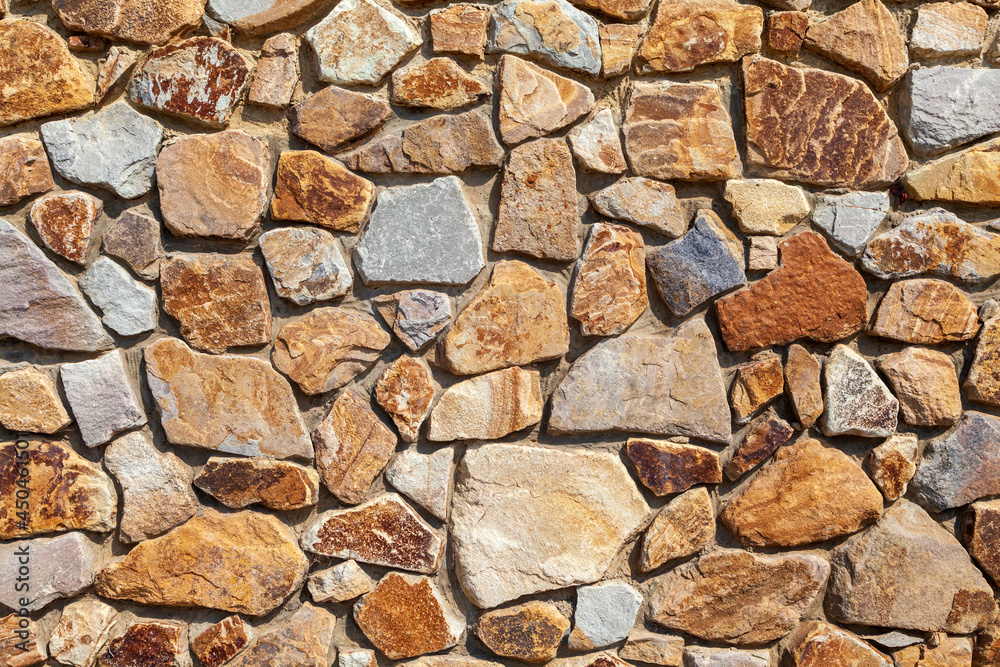 Background stone wall lined with natural stone, Background stone wall lined with natural stone,
