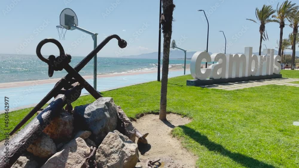 Cambrils beach in Barcelona Catalonia Spain poster white letters anchor view of the turquoise blue sea Cambrils beach in Barcelona Catalonia Spain poster white letters anchor view of the turquoise blue sea