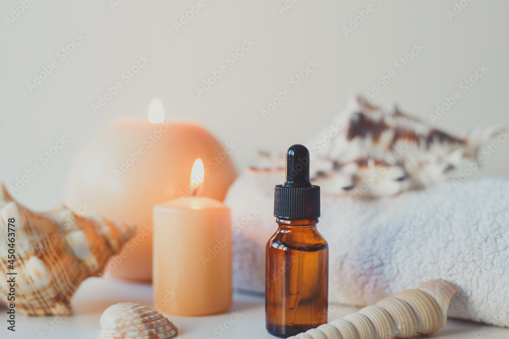 Brown glass bottles with serum, essential oil or other cosmetic product. Natural organic cosmetic packaging, skin care concept. Brown glass bottles with serum, essential oil or other cosmetic product. Natural organic cosmetic packaging, skin care concept.