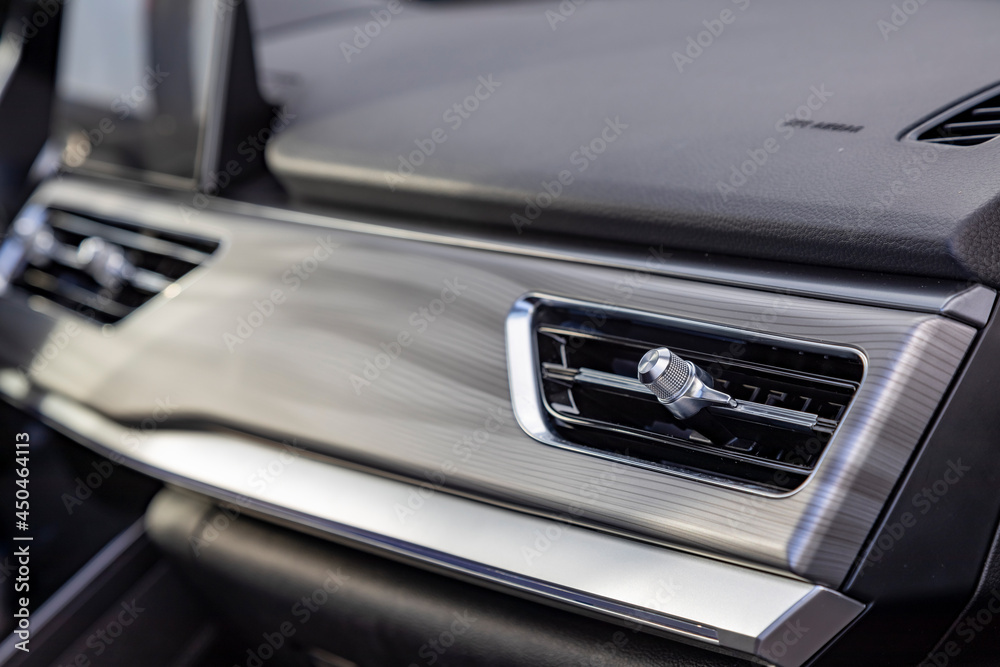 interior air duct on the front panel of a premium car