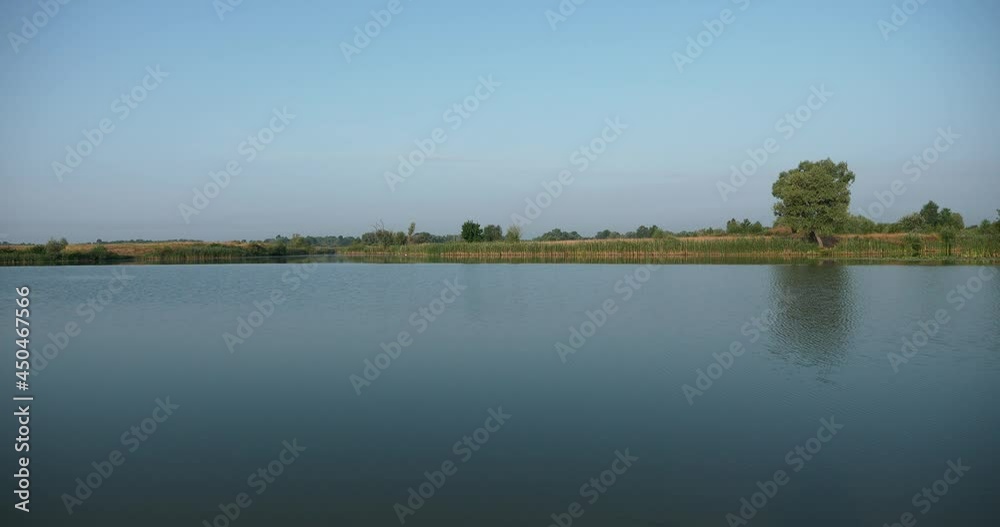 Calm Blue River Lake Pond Beautiful Picturesque Rural Scene. Clear Sky Country Summer Season Sunny Day 4K Calm Blue River Lake Pond Beautiful Picturesque Rural Scene. Clear Sky Country Summer Season Sunny Day 4K
