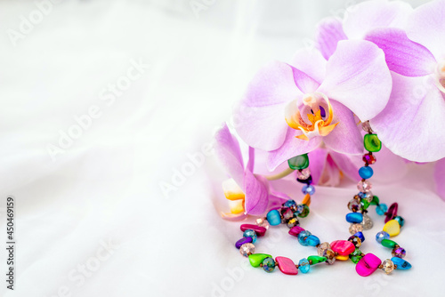Bracelet  on white fabric and purple Orchid
