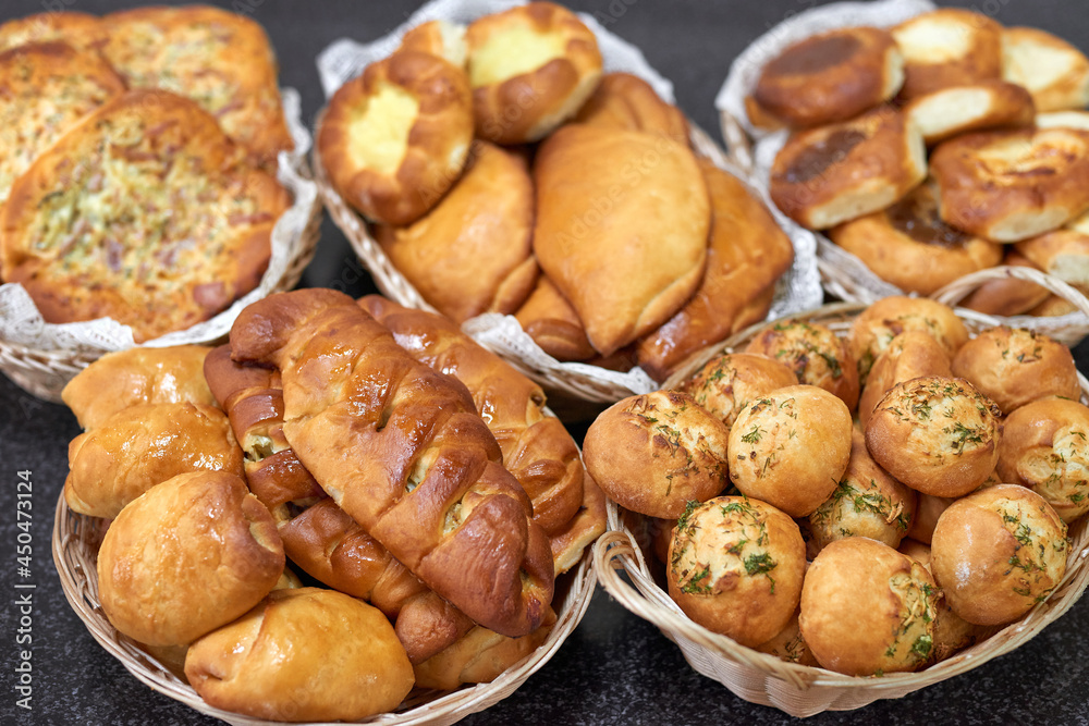 Bakery product assortment. Tasty pastries. Fresh bread, pies buns Bakery product assortment. Tasty pastries. Fresh bread, pies buns