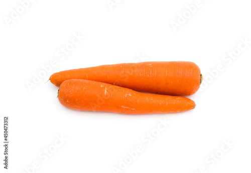 Two fresh ripe carrots on an isolated white background close up