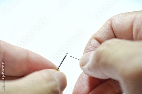 insert the thread into the sewing needle