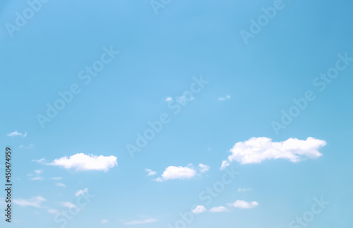 Clouds on vast bright blue sky background with natural space and light wind