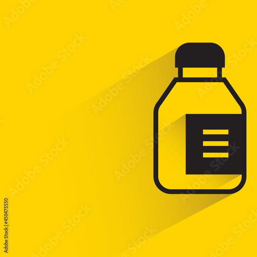 bottle with shadow on yellow background
