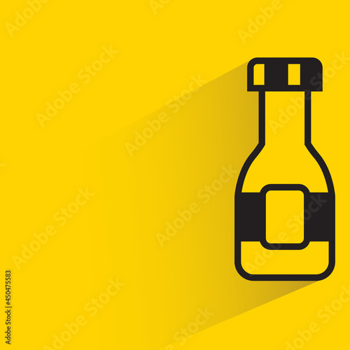 bottle with shadow on yellow background