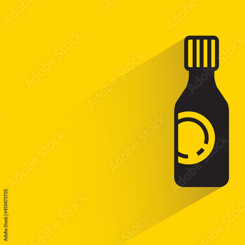 bottle with shadow on yellow background