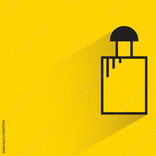 bottle with shadow on yellow background
