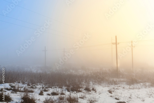 electric poles in the winter season, installed in the field
