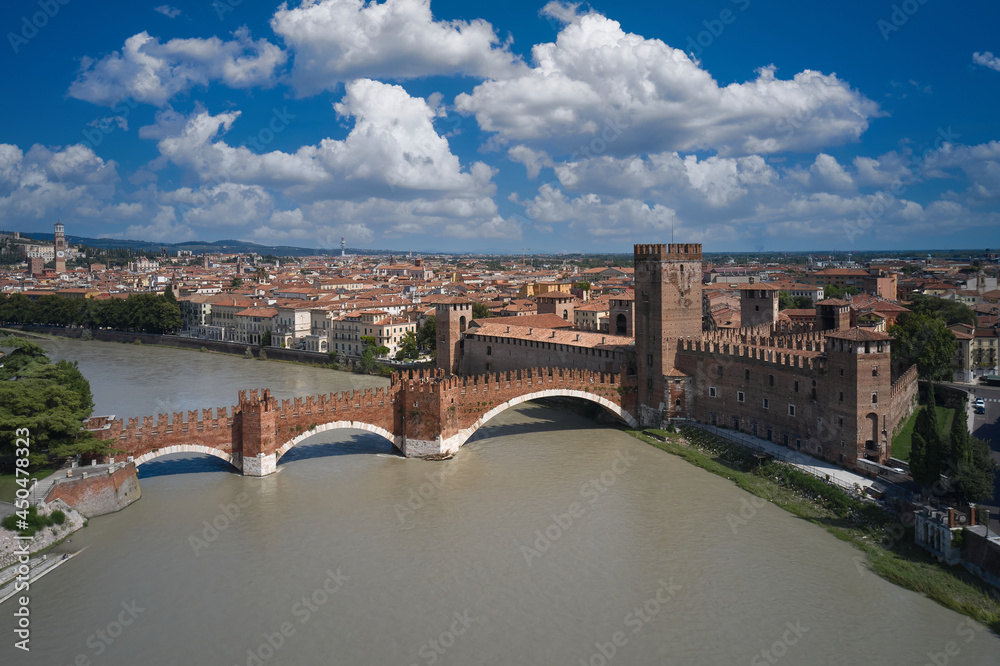 Verona in the region of Venice, Italy. Historic Castelvecchio Bridge, Ponte di Castelvecchio in Verona Italy. Panorama of the Ponte di Castelvecchio bridge. Bridge over the Adige river in Verona.