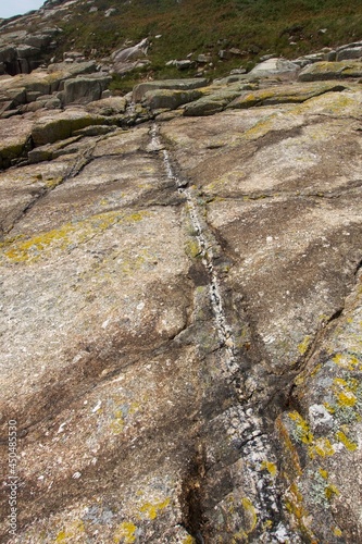 Cliffs, rocks, sea and surf on the Cornish coastline. On the Lands End pennisula between St Loy's Cove and Tater-Du lighthouse photo