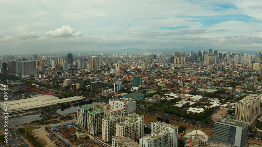 Cityscape of Makati, the business center of Manila. Asian metropolis with skyscrapers view from above. Travel vacation concept.