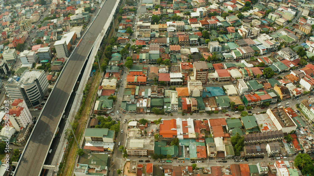 The city of Manila with density buildings, streets and roads from above. Travel vacation concept. The city of Manila with density buildings, streets and roads from above. Travel vacation concept.