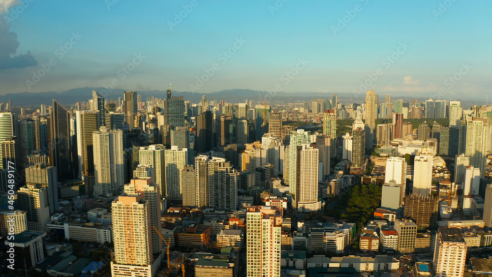 Obraz premium Aerial view of Panorama of Manila city. Skyscrapers and business centers in a big city. Travel vacation concept