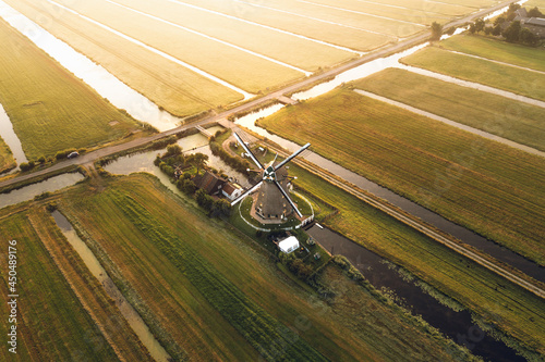 Aerial shot of a classic Dutch windmill in Aarlanderveen, The Netherlands. photo