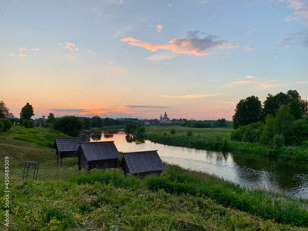 Fototapeta premium sunset on the river Suzdal, Russia