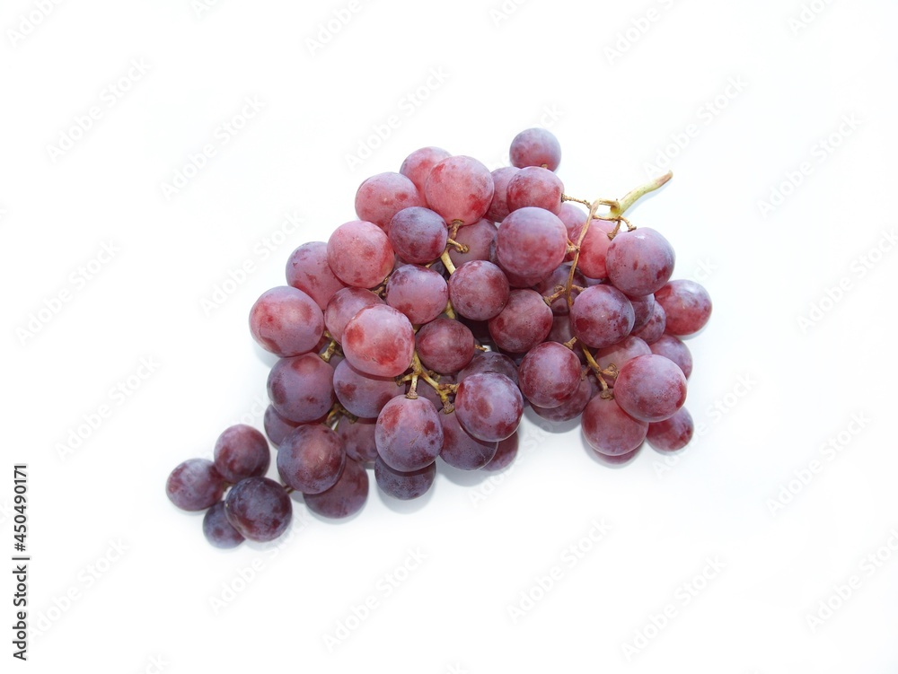 a bunch of ripe grapes on a white background