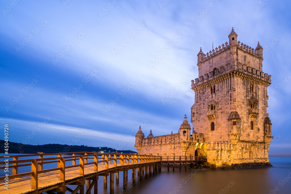 Belem Tower at night in the Tajo river bank in Belem neighborhood. UNESCO World Heritage Site.