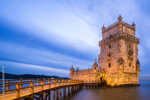 Belem Tower at night in the Tajo river bank in Belem neighborhood. UNESCO World Heritage Site. photo