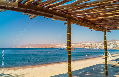 Fototapeta Naklejka Na Ścianę i Meble -  Sandy beach and relaxing atmosphere at central public beach in Eilat - famous tourist resort and recreational city in Israel 