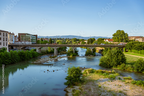 Carcassonne, France. View of river Aude and a modern bridge with cars and pedestrians. © SerFF79