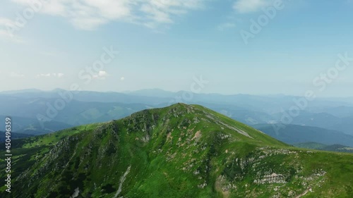 Arial View of peak Hutyn Tomnatyk mountain - Carpathian Mountains rage. Tourist places of Ukraine. Clear summer day. Concepts of tourism, environment and nature landscape. photo