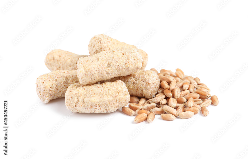 Granulated wheat bran and kernels on white background Granulated wheat bran and kernels on white background