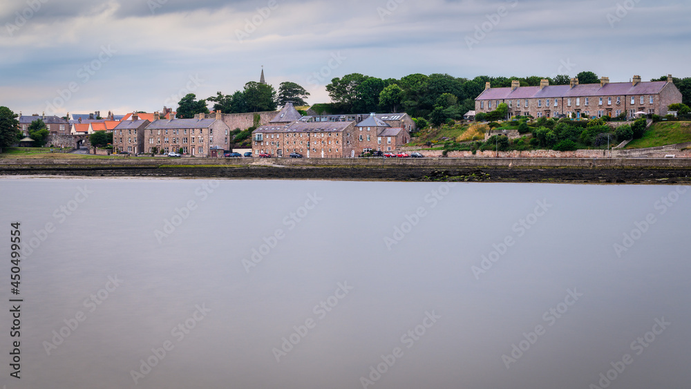 Berwicks Pier Road beyond the Tweed Estuary.  Berwick upon Tweed is the most northerly town in England and is located in Northumberland at the mouth of the River Tweed just below the Scottish border