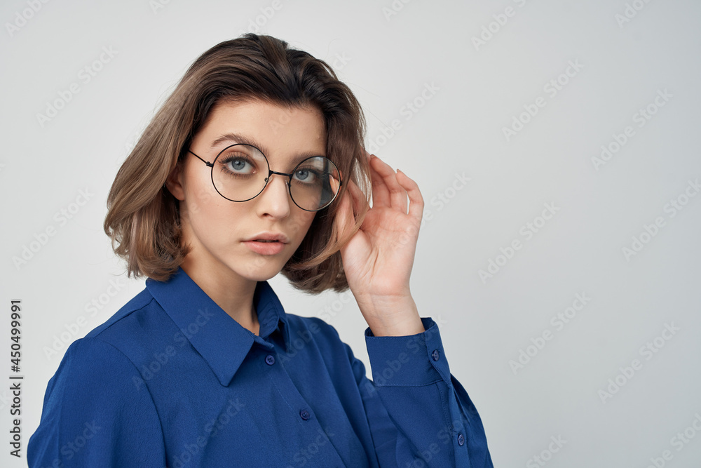 Business woman in blue shirt self-confidence manager office Business woman in blue shirt self-confidence manager office