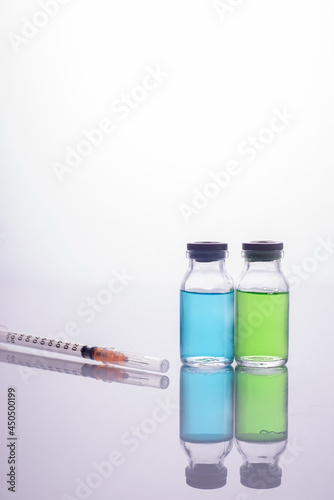 covid vaccine in glass vials, syringe. Vaccination against coronavirus