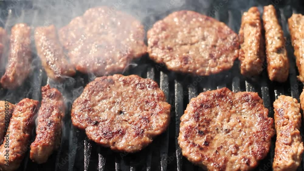 Delicious Juicy Burgers And Kebab Grilling on Charcoal Barbecue Delicious Juicy Burgers And Kebab Grilling on Charcoal Barbecue