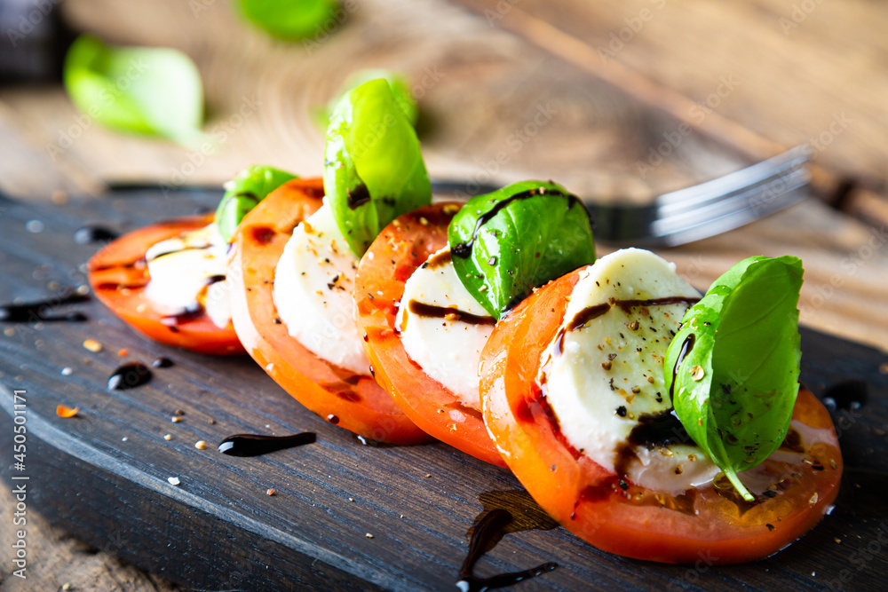 Ταπετσαρία Italian caprese salad on a cutting board