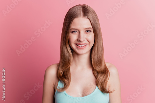 Portrait of lovely cute adorable positive lady toothy beaming smile on pink background