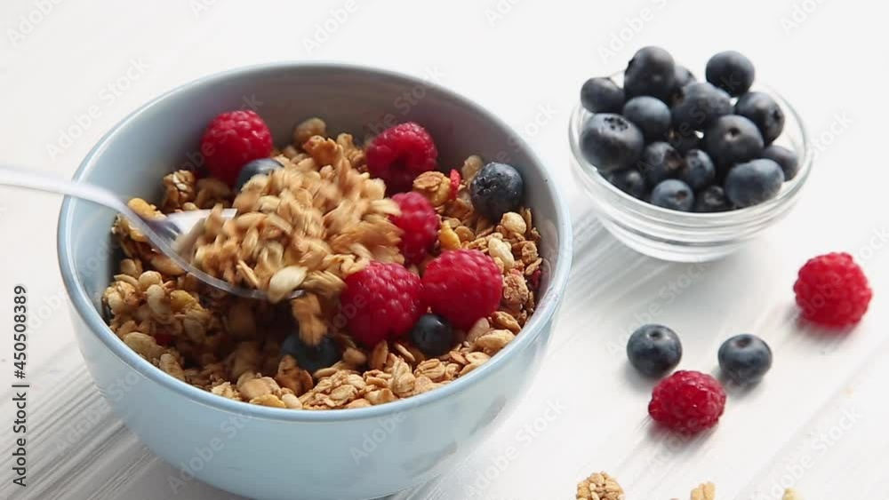 Granola with raspberries, blueberries and nuts. Granola with raspberries, blueberries and nuts.