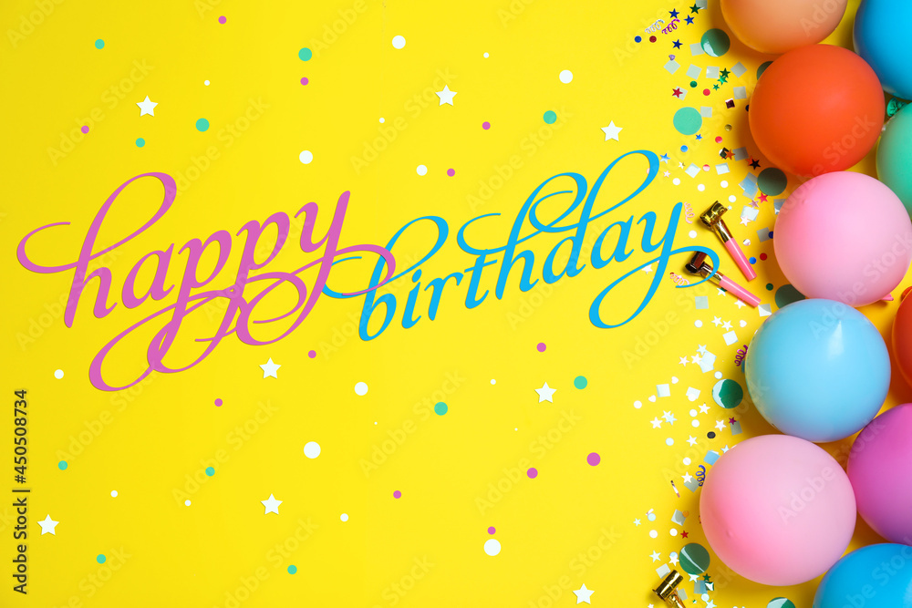 Happy Birthday! Flat lay composition with balloons and confetti on yellow background