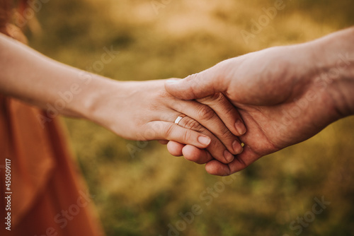 close up of couple holding hands © Mariya Shmatova
