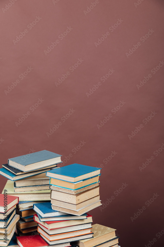 Stacks of books for teaching knowledge university library brown background Stacks of books for teaching knowledge university library brown background