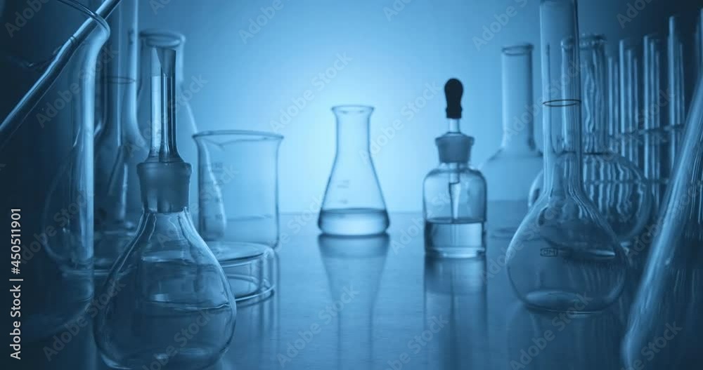 Scientist analyzing a sample in an erlenmeyer in the laboratory
