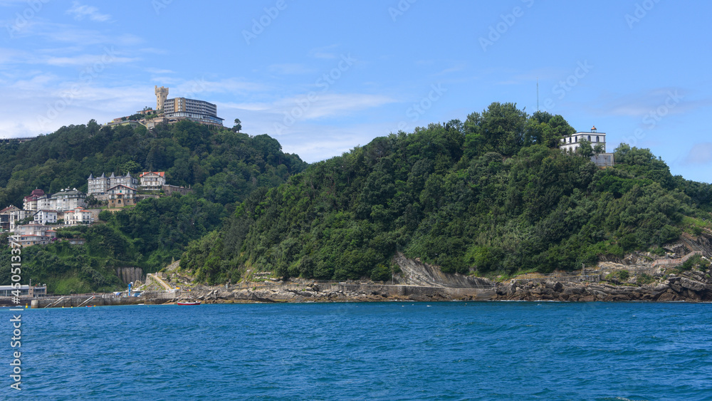 San Sebastian, Spain - 2 August 2021: Views of Monte Igueldo from Isla Santa Clara and La Concha Bay