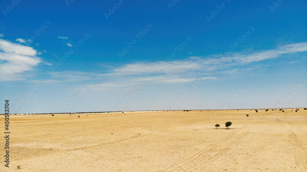 Obraz premium Aerial photograph of the vehicle driving in the African Sahara desert
