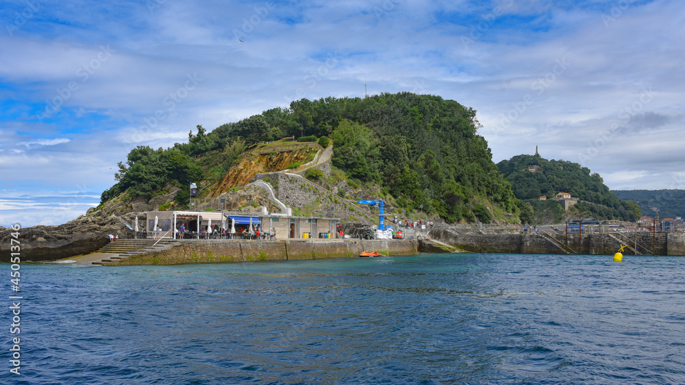 Fototapeta premium San Sebastian, Spain - 2 August 2021: Dock on Isla Santa Clara in the La Conca Bay