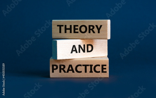 Theory and practice symbol. Wooden blocks with words 'Theory and practice' on a beautiful grey background. Business, theory and practice concept. Copy space.